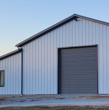Shop with siding roof and gutters from Apex Gutters LLC