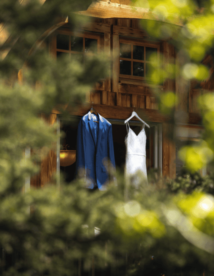 a wedding dress hanging on a cabin