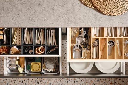 a kitchen with a shelf with utensils and utensils