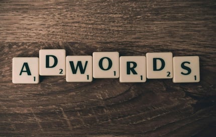 Adwords Tiles on Wooden Surface
