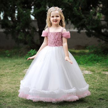 a little girl in a white dress with a pink princess bodice