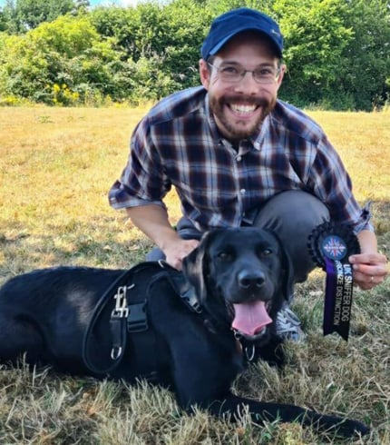 Geoff Bunce and his Dog Raven getting a distinction for UK Sniffer Dog testing