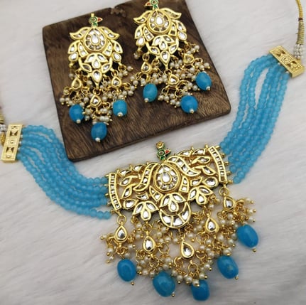 a necklace with a blue beaded necklace and a necklace