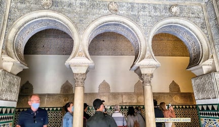  complicated latticework over a triple archway in Mudejar style building