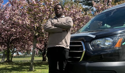 a man standing in front of a van