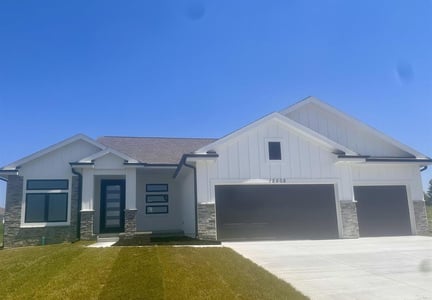 white ranch style home on Cooper St