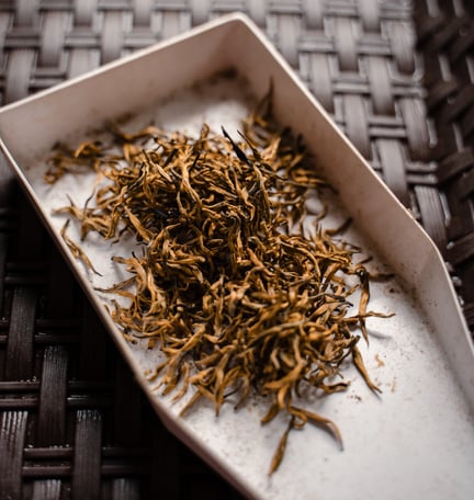 a plate with a pile of dried herbs