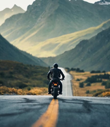 a man riding a motorcycle down a road