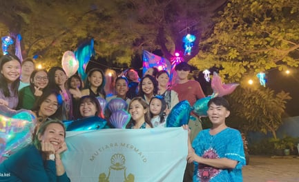 the Jakarta mermaid pod celebrating a birthday and all posing for a group picture