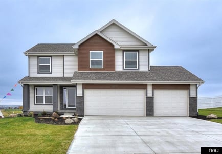 white and brown new construction home