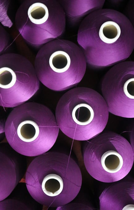 Purple yarn cones from top view