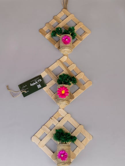 "Handmade recycled house model crafted from eco-friendly materials"