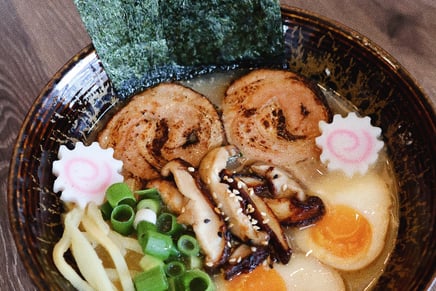 a bowl of ramen with noodles and vegetables