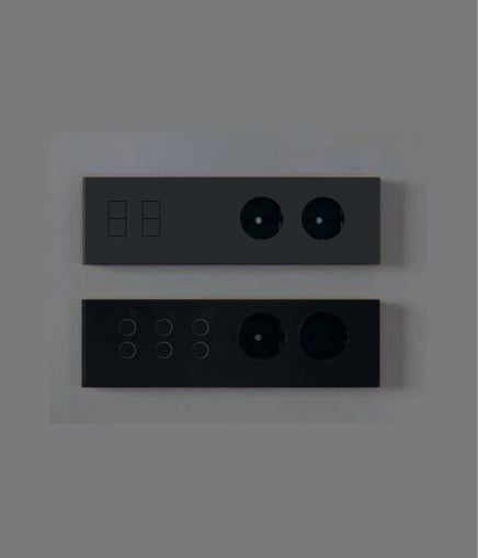 Diseño minimalista con interruptores empotrados en pared blanca junto a escalera contemporánea