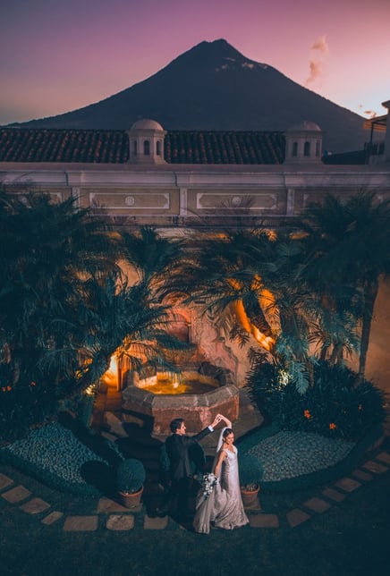 antigua guatemala wedding photograpaher- couple dancing with volcano in background