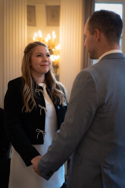 a man and woman holding hands and shaking hands