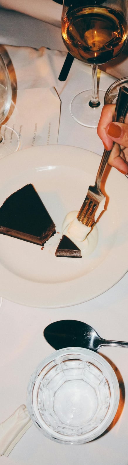 a woman eating desert at a restaurant booked through piano piano concierge where she met her husband