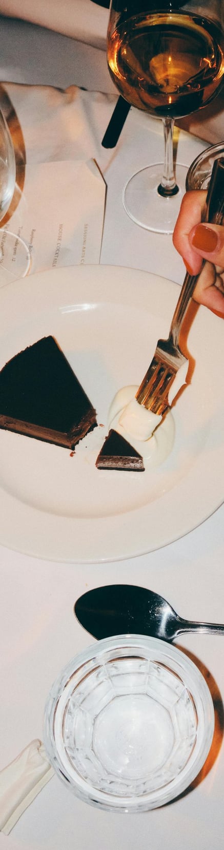 a woman eating desert at a restaurant booked through piano piano concierge where she met her husband