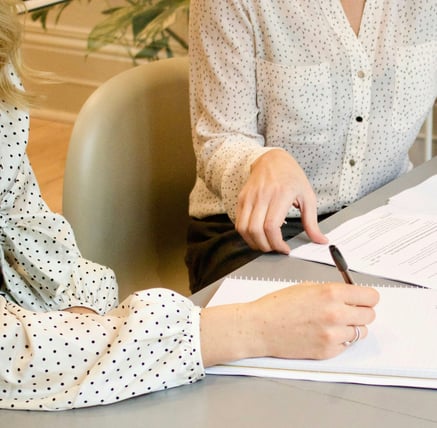 Two women sitting in a consulting and having in conversation in nutritional advice.