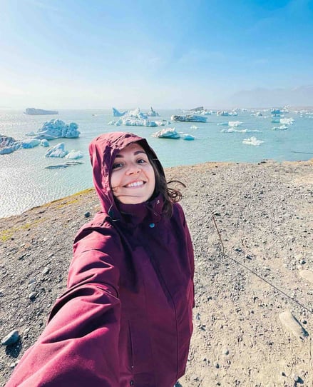Eva in front of icebergs in Iceland.