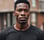 man wearing black crew-neck shirt