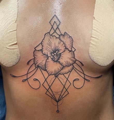 Graphic tattoo flowe with lines and circles