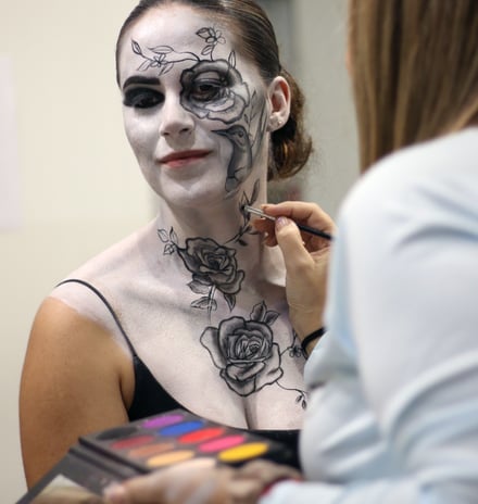 a woman with a face paint painted on her face