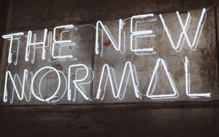 photo of neon sign saying The New Normal