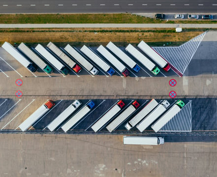 a parking lot with trucks parked in a parking lot