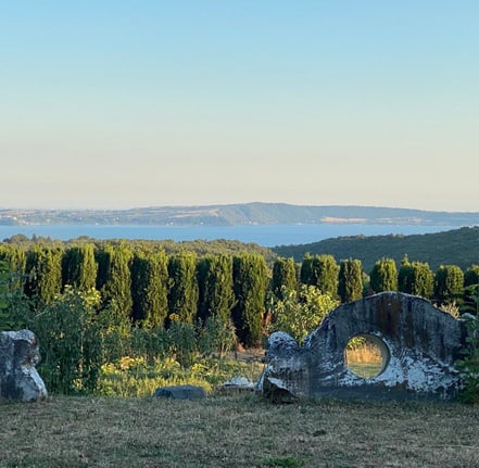 a couple of large rocks sitting on top of a hill