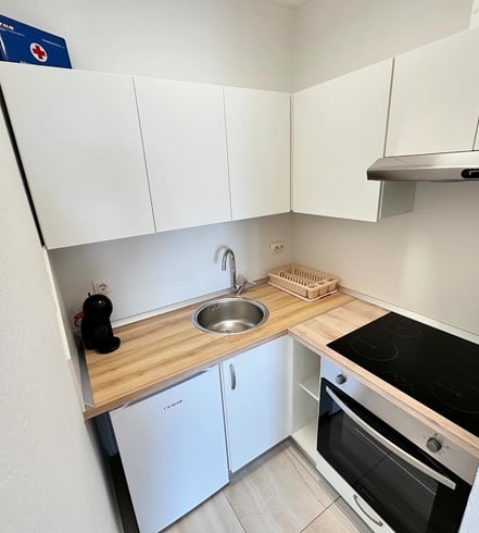 Kitchen with coffe machine and cooking space