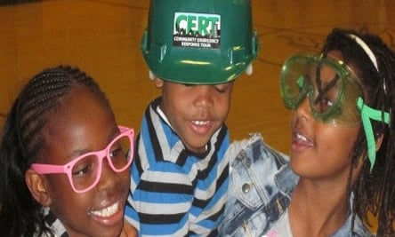 three young children wearing safety glasses and safety glasses