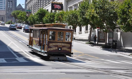 a trolley car on a city street in San Francisco