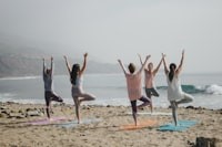 Health Vibes - Physical fitness like a yoga class on the beach helps you stay mentally healthy