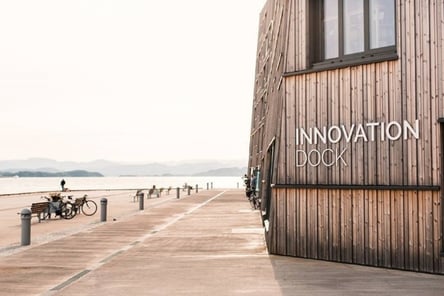 a wooden building with a sign that says innovation book