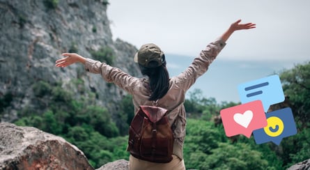 a woman with a backpack on a mountain