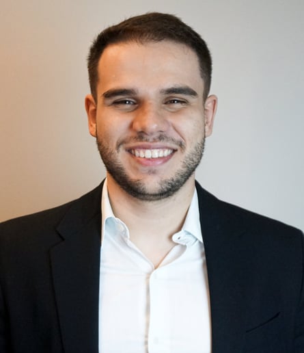 a man in a suit and white shirt