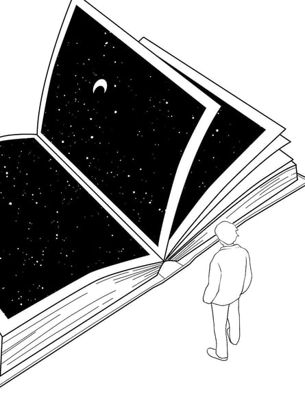 a person standing in front of a book