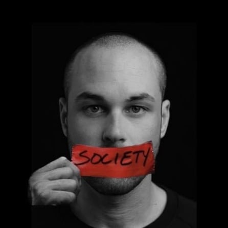 a man with a red tape tape taped on his mouth