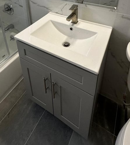 a bathroom with a sink and a shower