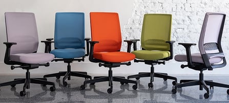 Five Sensit T129 clerical chairs in pastel purple, blue, orange, green, and side-view lilac, display