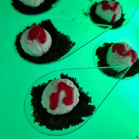 Green glow serving tray with canapes for halloween themed event in Redlands.