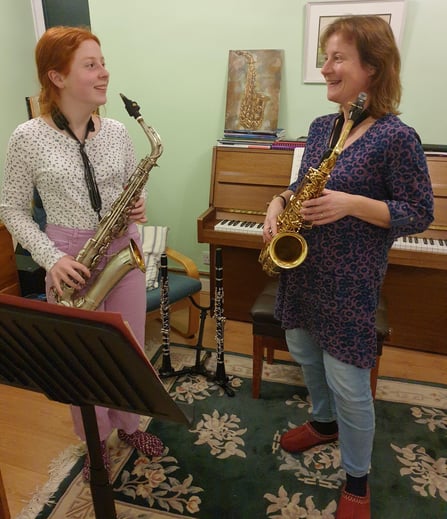 Verity Morris teaching the saxophone