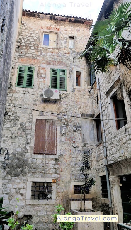 old mediaeval house in Kotor old town with broken windows 