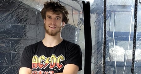 Jordan Clark with his mushroom cultivation tents before expansion.