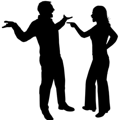 a man and woman standing in silhouettes
