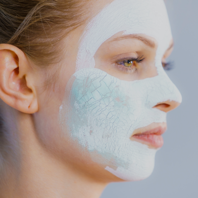 Woman using a blackhead mud mask