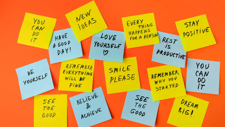 a bunch of sticky notes with words on them