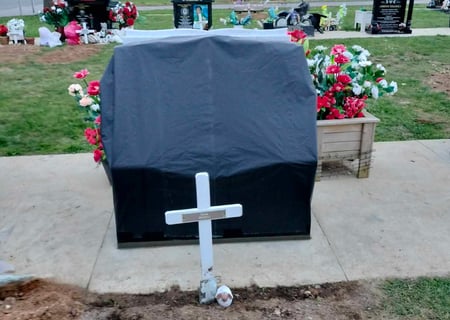 A headstone covered and ready for unveiling