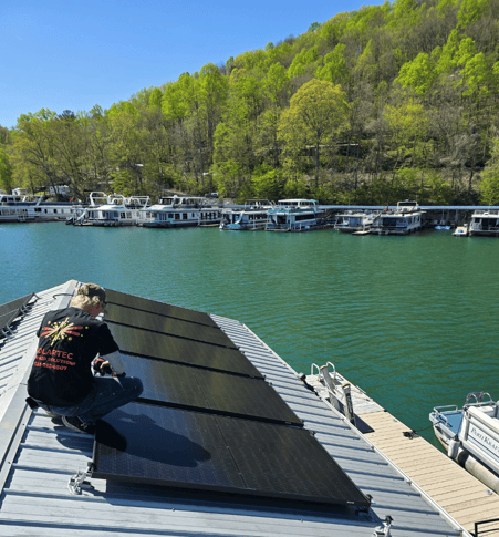 SolarTec installing solar panels on a floating cabin Norris Lake